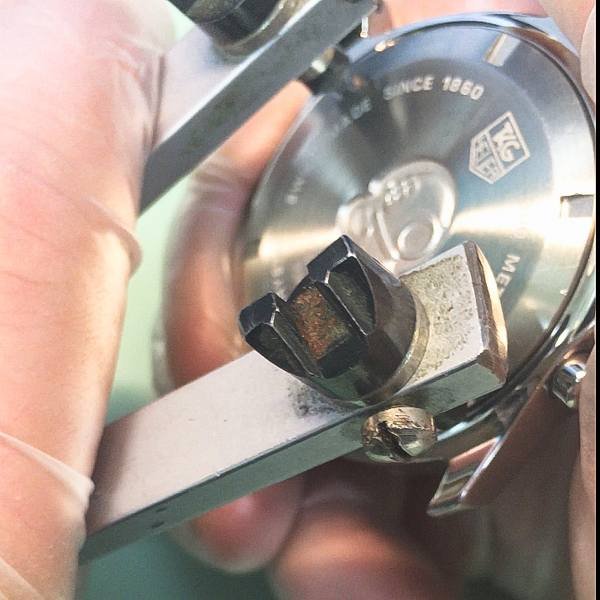 fitting and screwing the case-back into the tag heuer casing